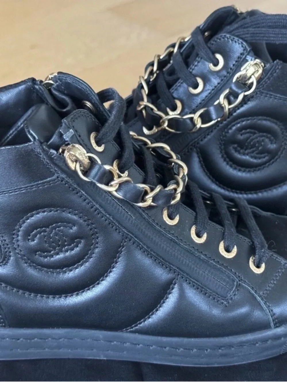 CHANEL Black Quilted High-Top Leather Sneakers with Gold Hardware